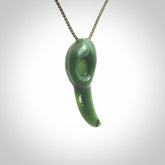 Hand carved huia bird skull made from New Zealand Marsden Jade pendant. Carved for NZ Pacific by Kyohei Noguchi. This is a contemporary piece of jewellery that is carved with intricate detail and clearly shows a beautiful bird skull. We ship this free worldwide with Express Courier.